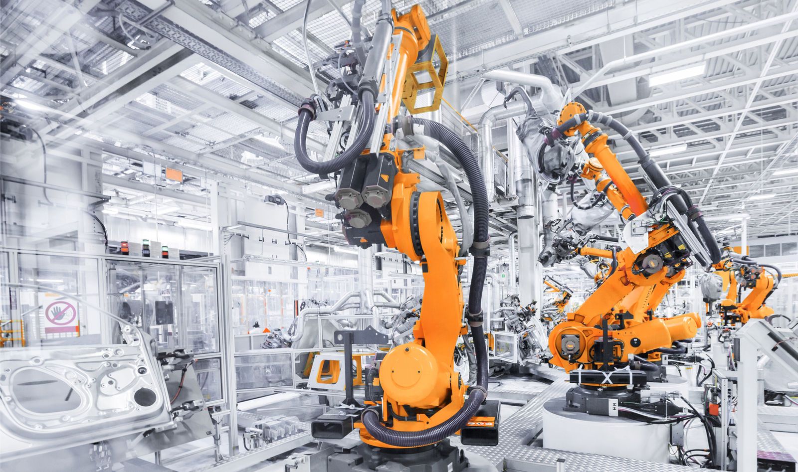 Industrial robots operating in an automotive factory